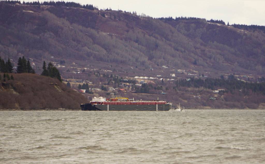 The Cook Inlet Spill Prevention and Response Inc. barge Redoubt is aground on the Mud Bay beach in Kachemak Bay off Kachemak Drive at about 1:30 p.m. Thursday, March 31, 2022, in Homer, Alaska. (Photo by Michael Armstrong/Homer News)