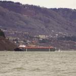The Cook Inlet Spill Prevention and Response Inc. barge Redoubt is aground on the Mud Bay beach in Kachemak Bay off Kachemak Drive at about 1:30 p.m. Thursday, March 31, 2022, in Homer, Alaska. (Photo by Michael Armstrong/Homer News)