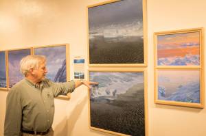 David Rosenthal describes work from his travels around the Arctic Ocean and through the Northwest Passage from his show, "Painting at the Edge of the Ice Age," at the Pratt Museum & Park in Homer, Alaska. (Photo by Sean McDermott)