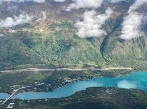 An area cleared to make way for the Cooper Landing Bypass project can be seen above the intersection of the Kenai River and Kenai Lake in Cooper Landing, Alaska, on Sept. 6, 2021. (Photo by Jeff Helminiak/Peninsula Clarion)