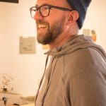 Composer Nathan Hall listens to a practice session with other musicians before his Friday, April 15, 2002, Bunnell Arts by Air performance at Bunnell Street Arts Center in Homer, Alaska. (Photo by Sean McDermott)