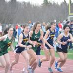 Runners in the girls 1,600-meter event start on Saturday, April 23, 2022 for the Homer Invite at Homer High School in Homer, Alaska. Mariner Eryn Field is third from left and Mariner Elena Badajos is second from right. (Photo by Michael Armstrong/Homer News)