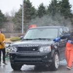 Members of the Homer Mariner baseball team wash cars for a fundraiser on Saturday, April 23, 2022, at Wells Fargo in Homer, Alaska. The Mariners play Friday vs. Redington High School in Wasila and Saturday vs. Barlett and Service in Anchorage. (Photo by Michael Armstrong/Homer News)