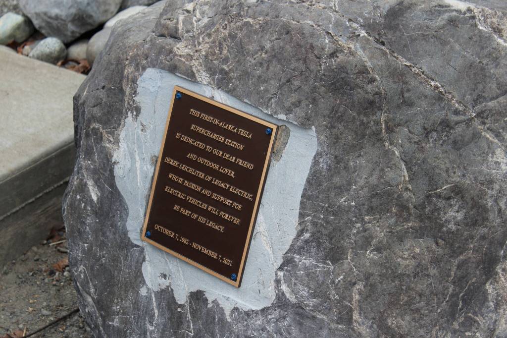 A plaque dedicates Alaskas first Tesla Supercharger on Saturday, April 30, 2022, in Soldotna, Alaska. (Ashlyn OHara/Peninsula Clarion)