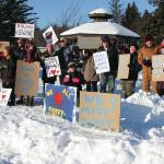 Friends of Anesha “Duffy” Murnane and members of the community supporting the campaign to bring her home pose with signs during a candlelight vigil held at WKFL Park in Homer, Alaska on Saturday, Feb. 1, 2020. (Photo by Delcenia Cosman)