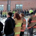Firefighters and medics lines the steps to Homer High School before a memorial for Gary Thomas on Sunday, Jan.19, 2020 in Homer, Alaska. Thomas, a community advocate and volunteer firefighter for more than 40 years, died on Jan. 14, 2020, in a water heater explosion at a home out East End Road. (Photo by Megan Pacer/Homer News)