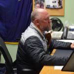 Henry Burns, principal of Seward High School, works in his office in in Seward, Alaska on Tuesday, May 3, 2022. (Camille Botello/Peninsula Clarion)