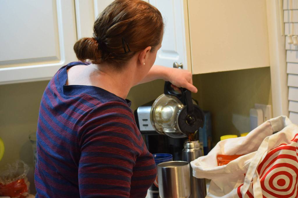 Christina Burns pours a cup of coffee in her Anchorage, Alaska home at around 4 a.m. on Tuesday, May 3, 2022. (Camille Botello/Peninsula Clarion)
