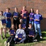 The Homer High School Mariner Logbook staff pose with the 2022 edition at Homer High School in Homer, Alaska. In the back row from left to right are Courtney Rider, Kamdyn Doughty, Bethany Engebretsen, Tyson Walker, Ally High and Charlotte Fraley. In the front row from left to right are Kapitolina Reutov, Mariah McGuire (editor), Suzanne Bishop (advisor) and Damon Weisser. (Photo provided)