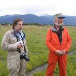 Michael Armstrong, left, wears a flight suit while doing a helicopter tour of agricultural sites in Kachemak Bay in 2008. At right is cattle rancher Chris Rainwater. (Photo provided, U.S. Department of Agrculture)