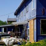 The south side of 397 E. Pioneer Avenue as seen on Friday, May 27, 2022. The barn door to the right was cut into the wall of the former Refuge Chapel, a modifcation other tenants of the building claimed had been done in violation of the business condominium association rules. (Photo by Michael Armstrong/Homer News)