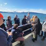Members of Homer Flex School's Marine Biology class on April 21, 2022, prepare to deploy a CTD, or conductivity, temperature, and depth, device in Kachemak Bay, Alaska. (Photo provided, Center for Alaskan Coastal Studies)