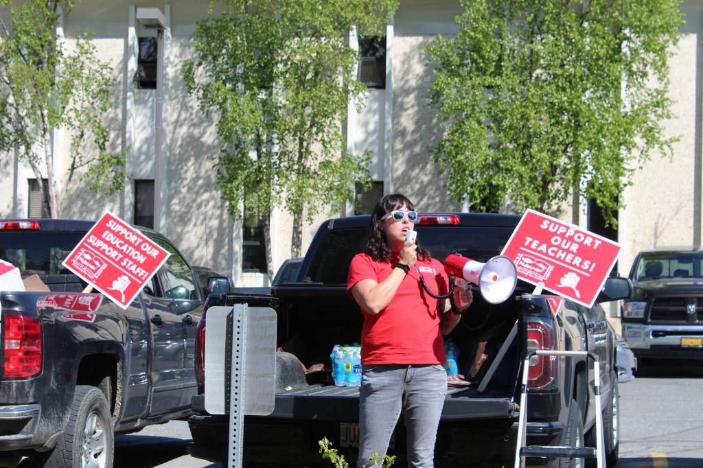 Rebecca Dixon speaks in support of Kenai Peninsula Borough School District teachers and support staff during a rally outside of the George A. Navarre Admin Building on Thursday, May 26, 2022 in Soldotna, Alaska. (Ashlyn OHara/Peninsula Clarion)