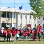 Demonstrators rally in support of Kenai Peninsula Borough School District teachers and staff outside of the George A. Navarre Admin Building on Thursday, May 26, 2022 in Soldotna, Alaska. (Ashlyn OHara/Peninsula Clarion)