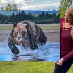 Tarryn Zerbinos shows one of her paintings to be displayed in June at Grace Ridge Breweing. (Photo provided)