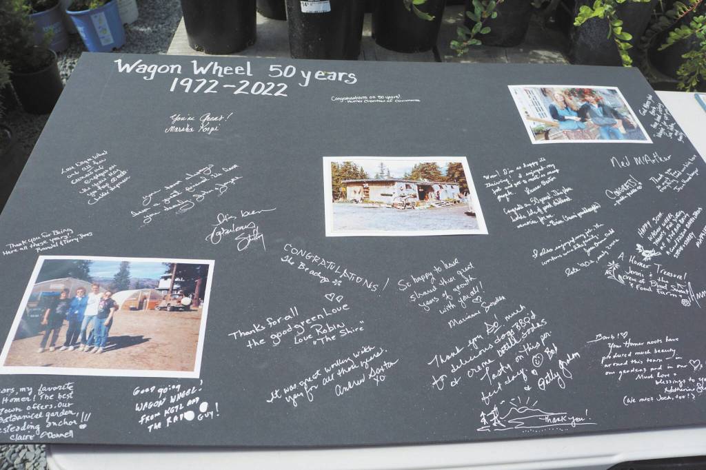 People signed a card for Wagon Wheel Garden & Pet founder Barb Walker at the 50th anniversary celebration of the iconic Homer store on Friday, June 10, 2022, in Homer, Alaska. (Photo by Michael Armstrong/Homer News)