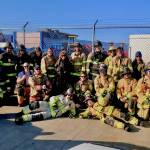 Graduates of a multi-agency EMT class pose at the training site on the Homer Spit. (Photo provided)