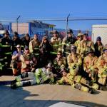Graduates of a multi-agency EMT class pose at the training site on the Homer Spit. (Photo provided)