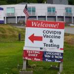 A sign points the way to the South Peninsula Hospital COIVD-19 testing and vaccine clinic at 4201 Bartlett Street on Flag Day, Tuesday, June 14, 2022, in Homer, Alaska. (Photo by Michael Armstrong/Homer News)