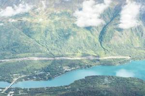 An area cleared to make way for the Cooper Landing Bypass project can be seen above the intersection of the Kenai River and Kenai Lake in Cooper Landing, Alaska, on Sept. 6, 2021. (Photo by Jeff Helminiak/Peninsula Clarion)