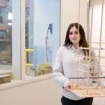 ANSEP Acceleration Academy (Summer) student Alivia Fefelov poses on Tuesday, June 21, 2022, at the University of Alaska Anchorage with a balsa tower she helped build to learn about engineering structures to survive earthquakes. The tower withstood a simulated earthquake. (Photo provided)