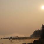 Smoke from wildfires in Southwestern Alaska casts a pall over Beluga Lake on Wednesday morning, June 29, 2022, in Homer, Alaska. (Photo by Michael Armstrong/Homer News)