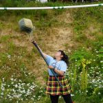Evelyn Delgado participates in the sheaf toss at the Kachemak Bay Highland Games on Saturday, July 2, 2022, at Karen Hornaday Park in Homer, Alaska. (Photo by Michael Armstrong)