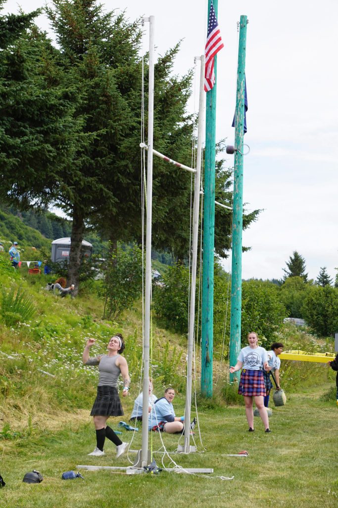 Norma jean Farr makes a successful throw in the weight-for-height event at the Kachemak Bay Highland Games on Saturday, July 2, 2022, at Karen Hornaday Park in Homer, Alaska. (Photo by Michael Armstrong)