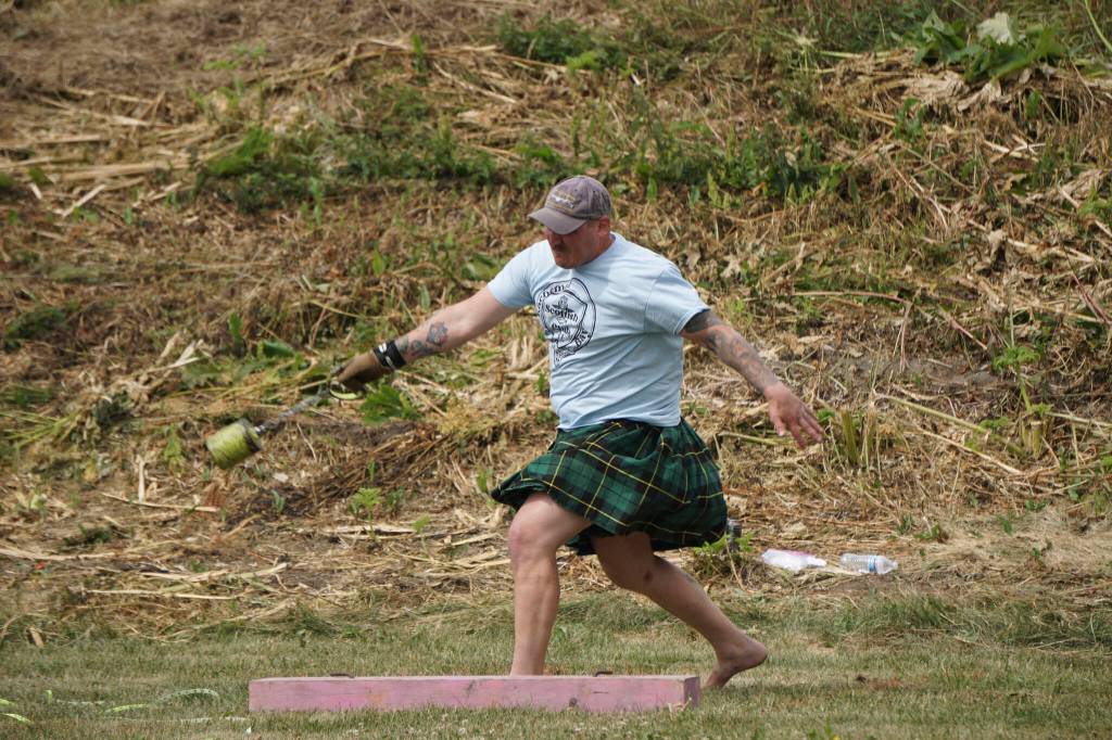 Dave Hancock throws in the weight-for-distance event at the Kachemak Bay Highland Games on Saturday, July 2, 2022, at Karen Hornaday Park in Homer, Alaska. (Photo by Michael Armstrong)