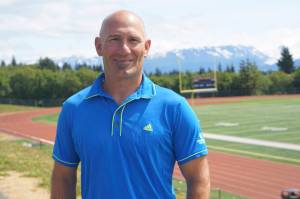 Former Homer High School athletic director poses on Friday, July 1, 2022, at the high school athletic field in Homer, Alaska. (Photo by Michael Armstrong/Homer News)