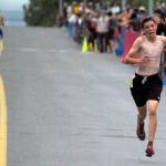 Palmers Coby Marvin finishes ahead of Ali Papillon of Boulder, Colorado, to win the boys junior Mount Marathon Race on Monday, July 4, 2022, in Seward, Alaska. (Photo by Jeff Helminiak/Peninsula Clarion)