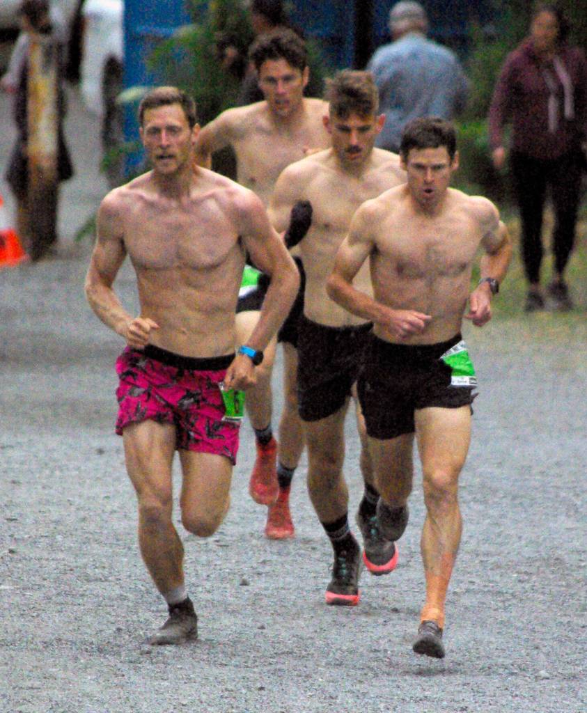 Lars Arneson and Max King race in the lead pack at the mens Mount Marathon Race on Monday, July 4, 2022, in Seward, Alaska. King won, while Arneson was third. (Photo by Jeff Helminiak/Peninsula Clarion)