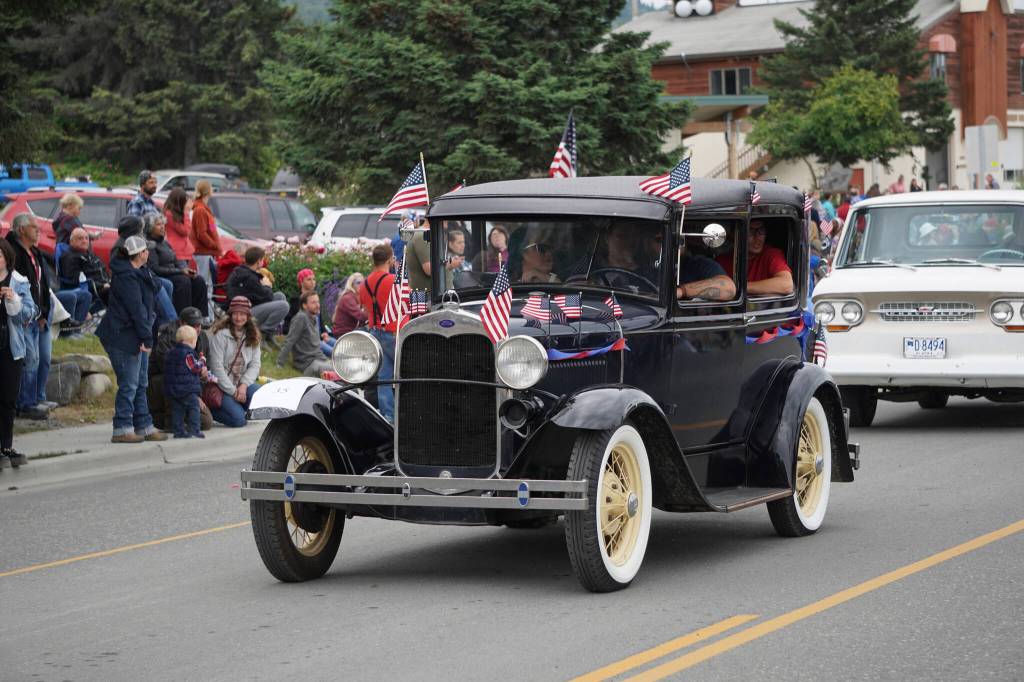 An antique Ford with Northern Enterprises was one of several classic cars driven in the Homer Fourth of July parade on Monday, July 4, 2022, on Pioneer Avenue in Homer, Alaska. (Photo by Michael Armstrong/Homer News)