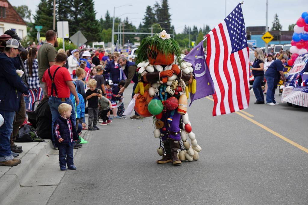The Bouyman entertains parade goers during the Homer Fourth of July parade on Monday, July 4, 2022, on Pioneer Avenue in Homer, Alaska. (Photo by Michael Armstrong/Homer News)