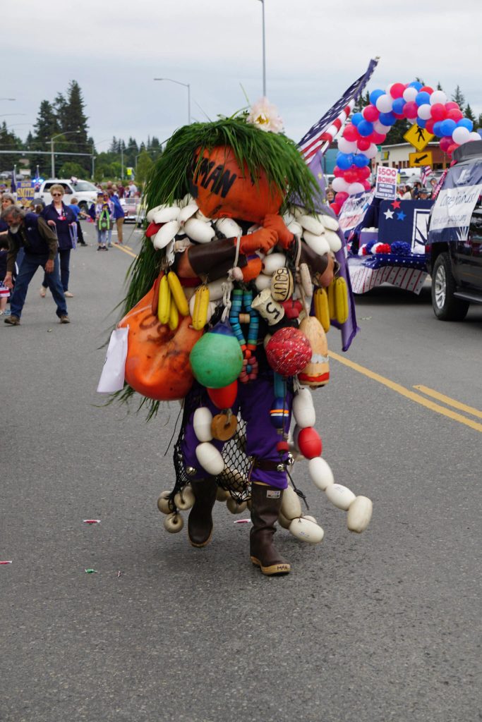 The Bouyman entertains parade goers during the Homer Fourth of July parade on Monday, July 4, 2022, on Pioneer Avenue in Homer, Alaska. (Photo by Michael Armstrong/Homer News)