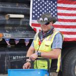 City of Homer Parks Director Matt Steffy hands out candy during the Homer Fourth of July parade on Monday, July 4, 2022, on Pioneer Avenue in Homer, Alaska. (Photo by Michael Armstrong/Homer News)