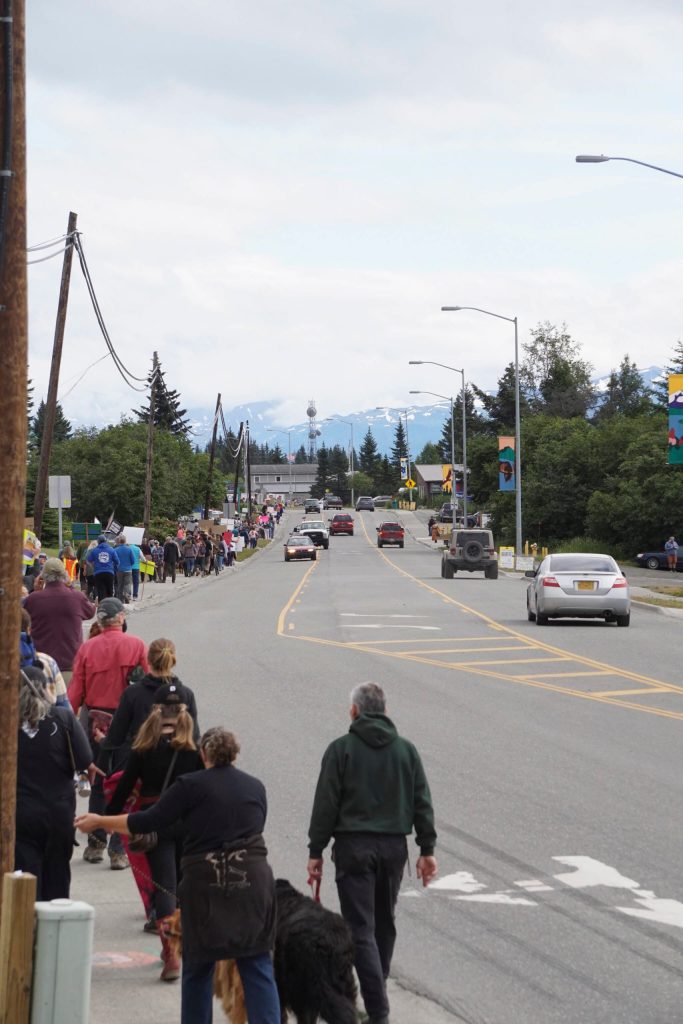 A group of about 400 people march along Pioneer Avenue for the Womens March: Bans Off Our Bodies protest on Saturday, July 9, 2022, in Homer, Alaska. The line of marchers stretched from about Main Street to Kachemak Way (Photo by Michael Armstrong/Homer News)