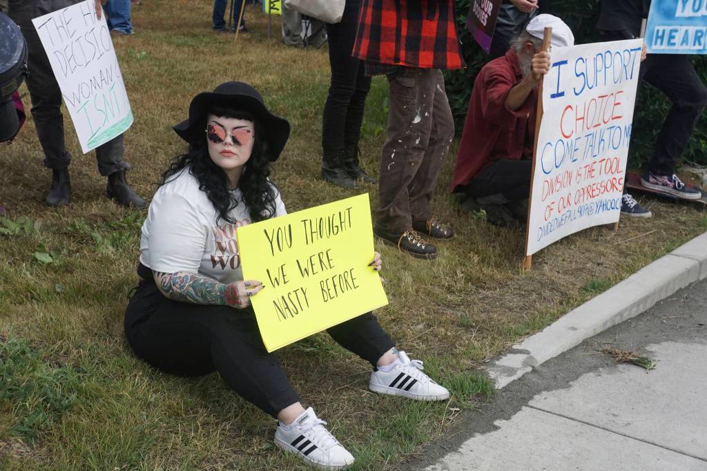 Salem Carrico-Roger holds a sign that reads You thought we were nasty before at the Womens March: Bans Off Our Bodies protest on Saturday, July 9, 2022, at WKFL Park in Homer, Alaska. (Photo by Michael Armstrong/Homer News)