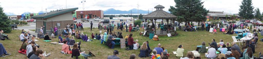 In this panoramic photo, people listen to speakers at the Womens March: Bans Off Our Bodies protest on Saturday, July 9, 2022, at WKFL Park in Homer, Alaska. (Photo by Michael Armstrong/Homer News)