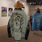 "Protection: Adaptation and Resistance" includes these robes, "Kaxhatjaa X'óow: Herring Protectors," made by Káakaxaawulga/Jennifer Younger, K'asheechtlaa/Louise Brady and Carol Hughey. The show is on exhibit at the Pratt Museum & Park in Homer, Alaska, through Sept. 24, 2022. (Photo by Michael Armstrong/Homer News)