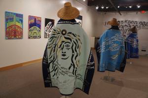 "Protection: Adaptation and Resistance" includes these robes, "Kaxhatjaa X'óow: Herring Protectors," made by Káakaxaawulga/Jennifer Younger, K'asheechtlaa/Louise Brady and Carol Hughey. The show is on exhibit at the Pratt Museum & Park in Homer, Alaska, through Sept. 24, 2022. (Photo by Michael Armstrong/Homer News)