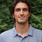 New Homer News reporter Charlie Menke poses for a photo on Friday, July 8, 2022, at the Homer News in Homer, Alaska. (Photo by Michael Armstrong/Homer News)