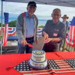 The Rotary Club of Homer-Kachemak Bay celebrated the accomplishments of one Rotary year and looked ahead to a new year at a social gathering July 1. Honored were Kim Zook, left, newly installed president of the club, and Bernie Griffard, immediate past president. At back is Marv Peters, a charter member of the club and one of the club’s directors.