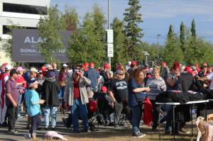People gather outside of the Alaska Airlines Center, where a Save America rally was being held, on Saturday, July 9, 2022 in Anchorage, Alaska. Former President Donald Trump, U.S. Senate candidate Kelly Tshibaka and U.S. House candidate Sarah Palin were among the events speakers. (Ashlyn OHara/Peninsula Clarion)