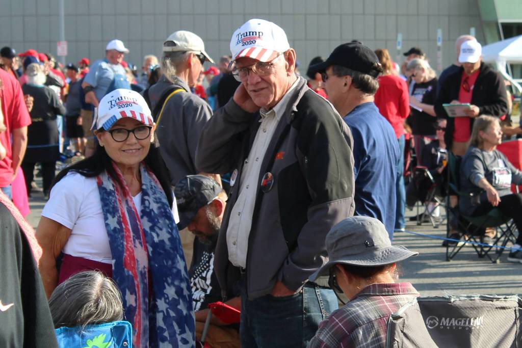 Mike (left) and Kathy (right) Medcoff wait to enter the Alaska Airlines Center for a Save America rally on Saturday, July 9, 2022 in Anchorage, Alaska. Former President Donald Trump, U.S. Senate candidate Kelly Tshibaka and U.S. House candidate Sarah Palin were among the events speakers. (Ashlyn OHara/Peninsula Clarion)
