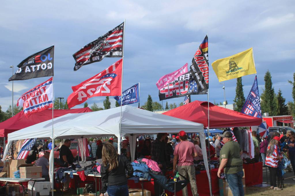 Vendors sell flags and other merchandise outside of the Alaska Airlines Center, where a Save America rally was being held, on Saturday, July 9, 2022 in Anchorage, Alaska. Former President Donald Trump, U.S. Senate candidate Kelly Tshibaka and U.S. House candidate Sarah Palin were among the events speakers. (Ashlyn OHara/Peninsula Clarion)