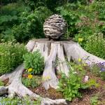 A garden at the home of Ralph Broshes and Deb Lowney features one of Lowney's sculptures. It was part of the walking tour portion of the Homer Garden Tour on Sunday, July 17, in Homer, Alaska.  (Photo by Charlie Menke/Homer News)