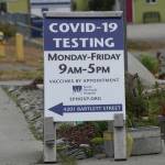 A new sign on July 2, 2022, on Pioneer Avenue and Bartlett Street indicates the new times and days for the South Peninsula Hospital COVID-19 testing and vaccine clinic on Bartlett Street. (Photo by Michael Armstrong/Homer News)