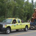 An Alaska Division of Forestry vehicle pulls Smokey Bear during the 65th annual Soldotna Progress Days Parade on Saturday, July 23, 2022, in Soldotna, Alaska. (Ashlyn OHara/Peninsula Clarion)