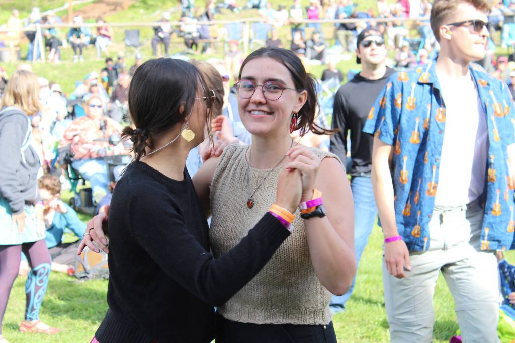 People gather in Ninilchik, Alaska, on Friday, Aug. 5, 2022, for Salmonfest, an annual event that raises awareness about salmon-related causes. (Camille Botello/Peninsula Clarion)